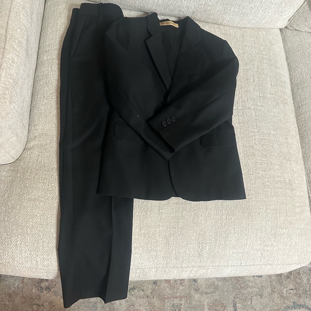 Boys black suit jacket and matching pants size 7 Slim. Perfect condition.